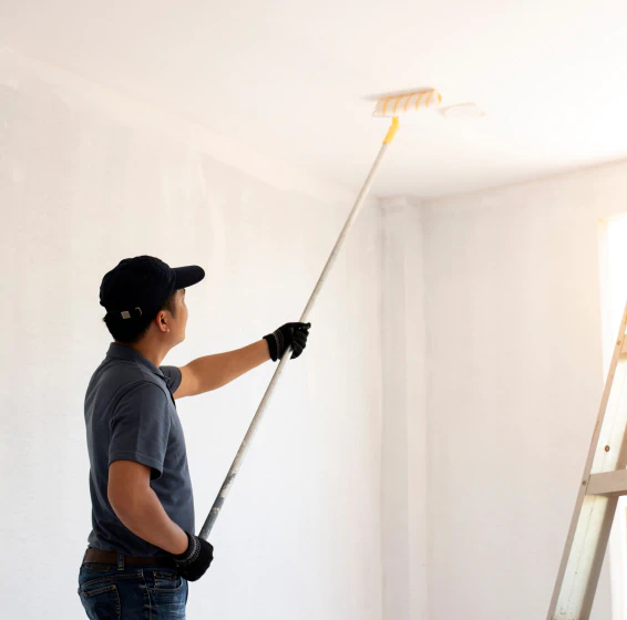 worker painting the home interior